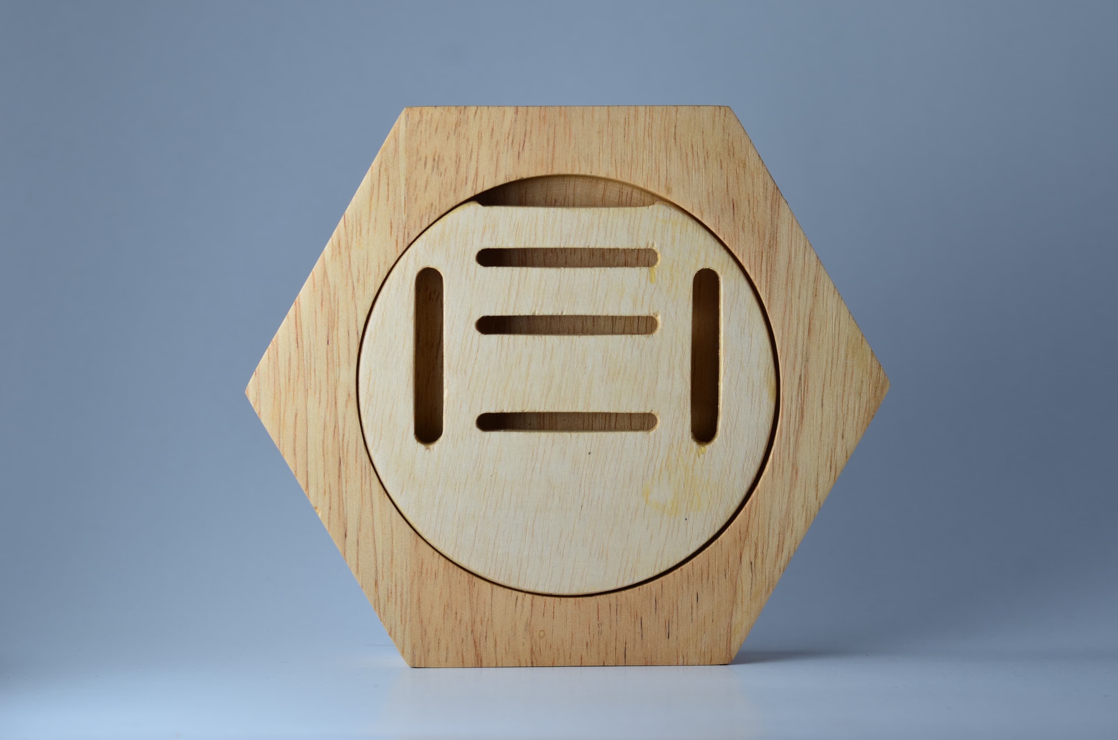 The Holder — hexagonal medal display, angled view